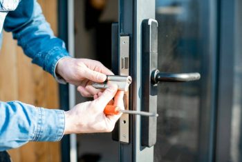 man-changing-core-of-a-door-lock-1